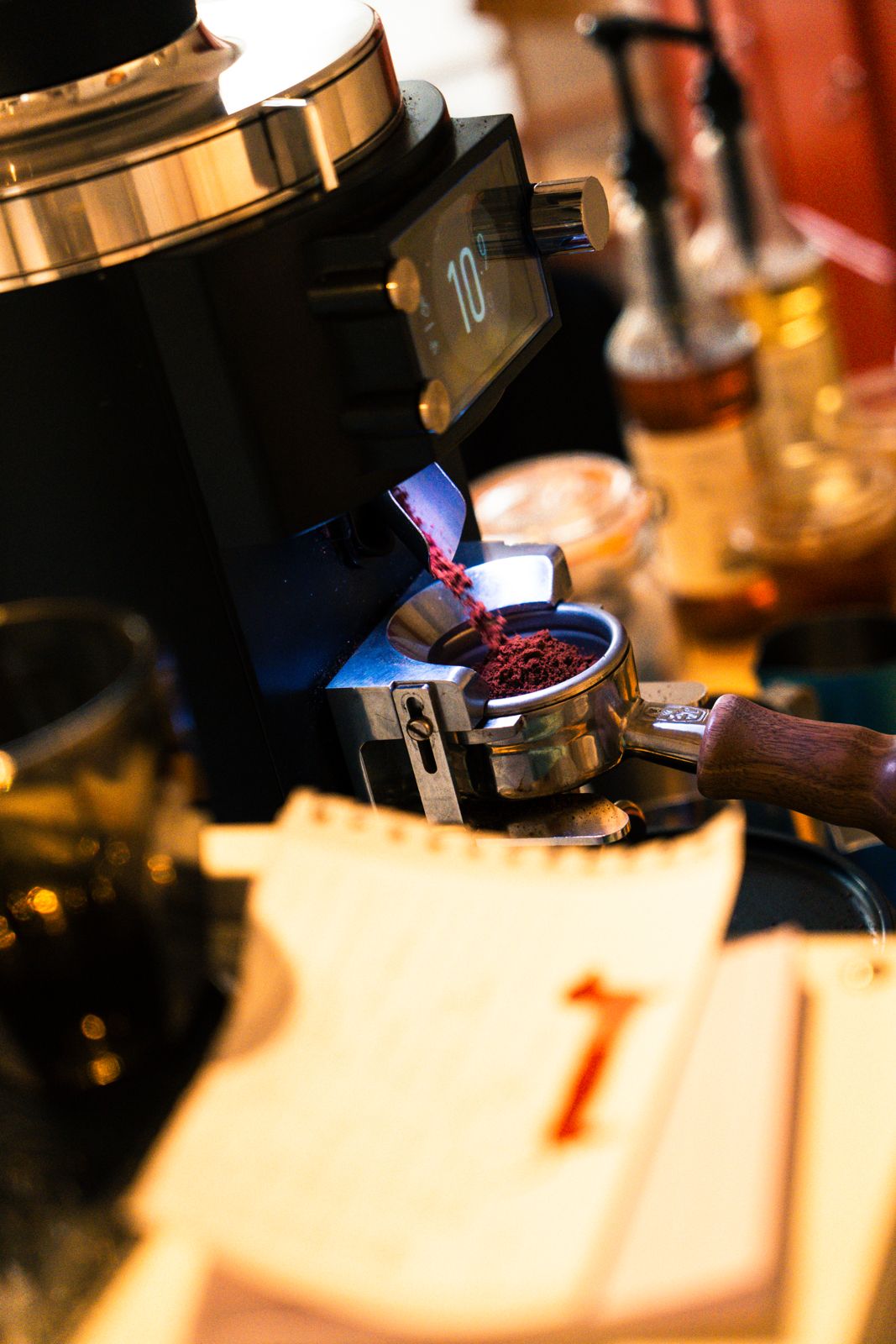 Freshly ground coffee going into the portafilter